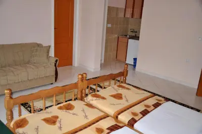 a living room with a bed and a couch at Apartments Perezaj in Ulcinj