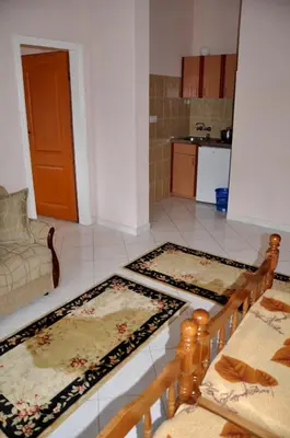 a living room with two rugs on the floor at Apartments Perezaj in Ulcinj