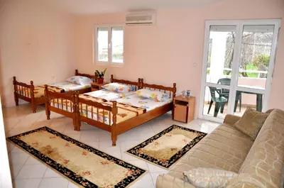a living room with a couch and a table at Apartments Perezaj in Ulcinj