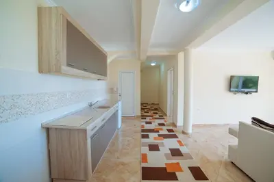 a kitchen with a sink and a counter top at Apartments Panorama Alaj in Ulcinj