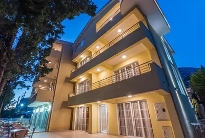 an apartment building at night with the lights on at Villa Antivari in Bar