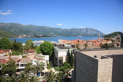 a view of a city with a body of water at Apia Residence in Budva