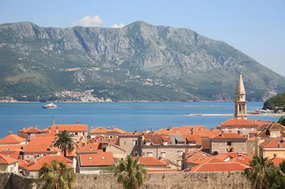 a view of a town with mountains in the background at Apia Residence in Budva