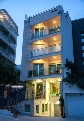 a tall building with balconies on the side of it at Apia Residence in Budva