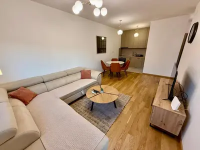 a living room with a couch and a table at Apartmants City Love in Podgorica