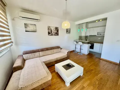 a living room with a couch and a table at Apartmants City Love in Podgorica