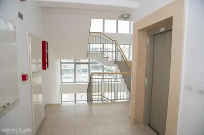 a hallway with a staircase in a building at City kvart na dan in Podgorica