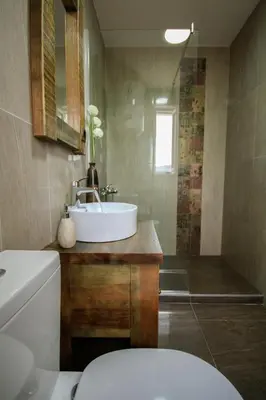 a bathroom with a sink and a toilet and a tub at Vida`s house in Virpazar