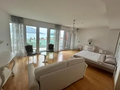 a living room with a bed and a couch at Apartments Krug in Budva