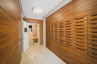 a walk in closet with wood panels and a hallway at Apartments Krug in Budva