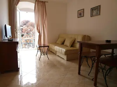 a living room with a couch and a table at Apartments Obala B&B - Dragović in Petrovac na Moru