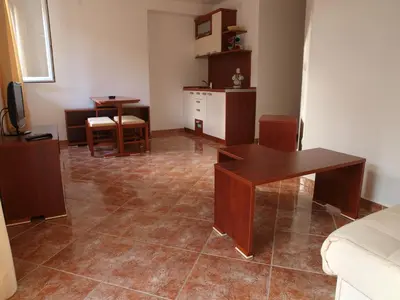 a living room with a couch and a table at Apartments Laništa - Dragović in Petrovac na Moru