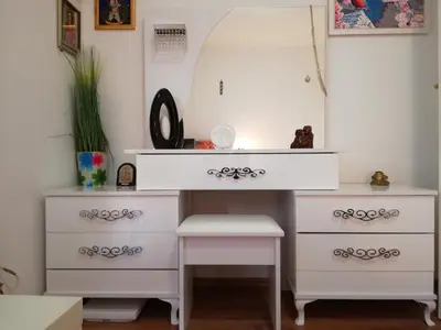 a dressing table and a desk with a drawer at Apartment White Lily of Budva in Budva