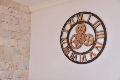 a clock on the side of a wall at Old Town Skyline apartment 3 in Budva