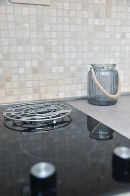 a stove top with a vase on a counter at Old Town Skyline apartment 3 in Budva