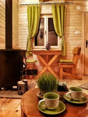 a living room with a table with two cups on it at Brvnara Borovik in Cetinje
