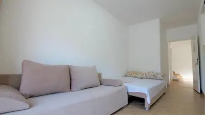 a living room with a couch and a table at MM Apartments in Budva