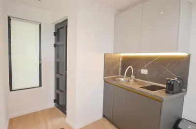 a kitchen with a sink and a counter top at Royal Olive Residence in Kotor