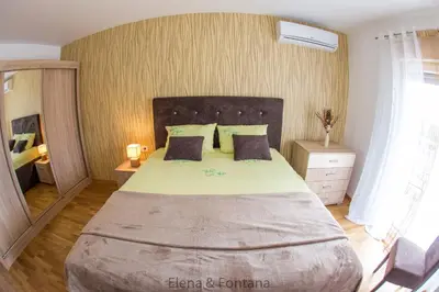 a bedroom with a large bed in a room at Elena&Fontana Apartment in Budva