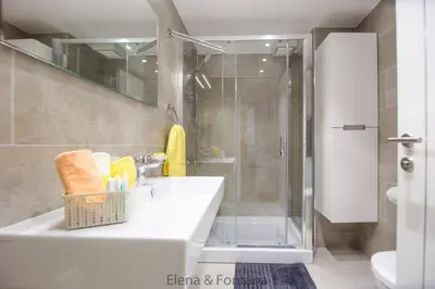 a bathroom with a sink and a shower at Elena&Fontana Apartment in Budva