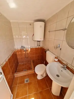 a bathroom with a toilet and a shower and a sink at Apartment Dragone in Ulcinj