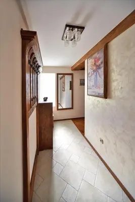 a hallway of a home with a door and a tile floor at Villa Dub in Kotor