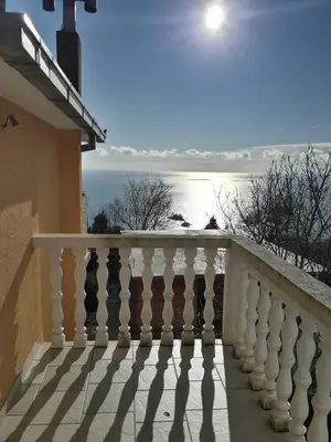 a balcony of a house with a view of the ocean at House Stijepovic in Petrovac na Moru