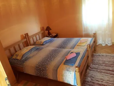 a bedroom with a large bed in a room at House Stijepovic in Petrovac na Moru