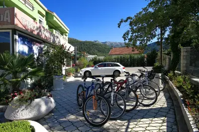 a row of bikes parked in front of a building at Hotel Aruba in Budva