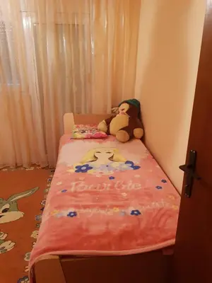 a childs bed with a teddy bear on it at Holiday Home Celuga in Bar