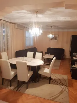 a dining room with a table and chairs at Holiday Home Celuga in Bar