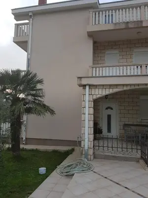 a house with a patio with a hose at Holiday Home Celuga in Bar