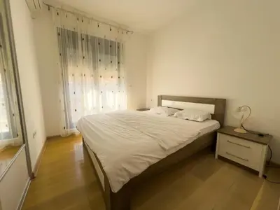 a bedroom with a bed and a large window at Sea View Apartments Perovic in Budva