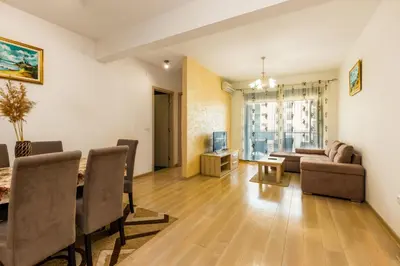 a living room with a couch and a table at Sea View Apartments Perovic in Budva