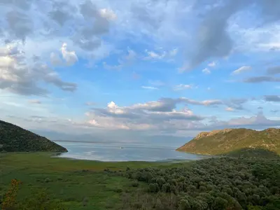 a view of a large body of water with mountains at Skadar lake Apartments Pajovic in Virpazar