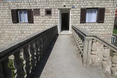 a stairway leading to a door in a brick building at Luxury Apartment Stefan in Sveti Stefan