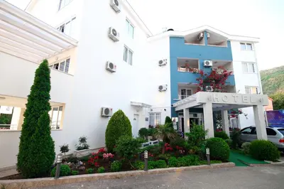 a hotel with a lot of flowers in front of it at Hotel Bella Vista in Budva