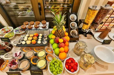 a table topped with lots of different types of food at Hotel Harmony by Aycon in Petrovac na Moru