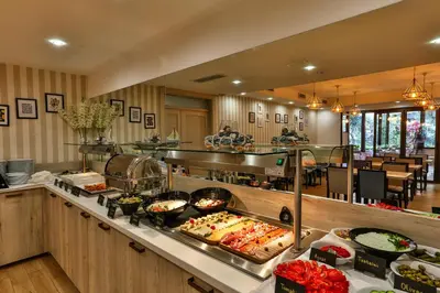 a buffet line with many different types of food at Hotel Harmony by Aycon in Petrovac na Moru