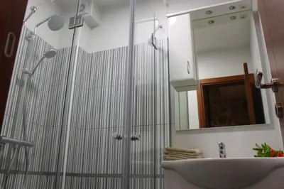 a bathroom with a shower and a sink at Luka Villa in Becici