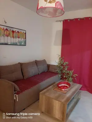 a living room with a couch and a table at Vila POGLED in Bar