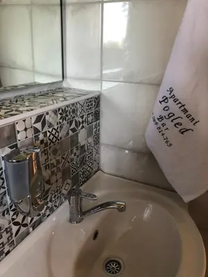 a bathroom sink with a towel on top of it at Vila POGLED in Bar
