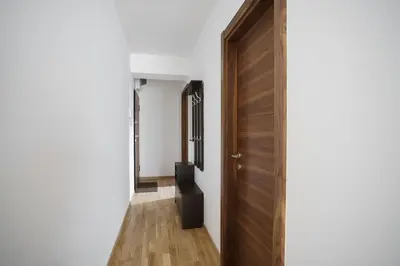 a hallway with a door leading into a room at Apartments LORA Jadranskij put in Budva