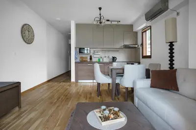 a living room with a couch and a table at Apartments LORA Jadranskij put in Budva