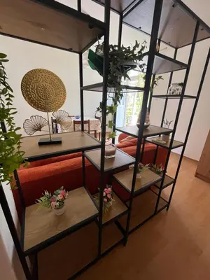 a room with shelves with potted plants on them at Apartment Dijana in Petrovac na Moru