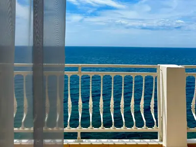 a view of the ocean from a balcony at Apartments & Rooms Elite in Dobra Voda