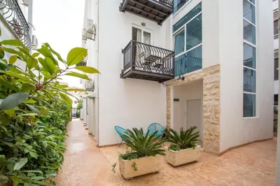 an empty courtyard of a building with plants at Villa DiEden in Budva