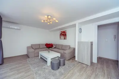 a living room with a couch and a table at Apartments Monte Re in Petrovac na Moru