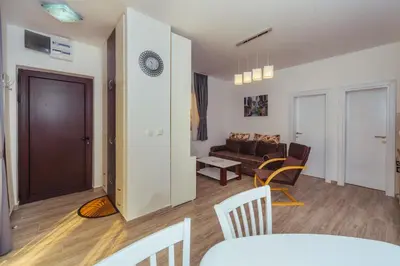 a living room with a couch and a table at Apartments Monte Re in Petrovac na Moru
