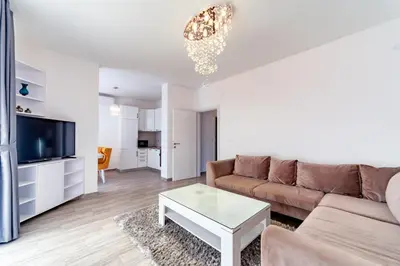 a living room with a couch and a coffee table at Apartments Monte Re in Petrovac na Moru
